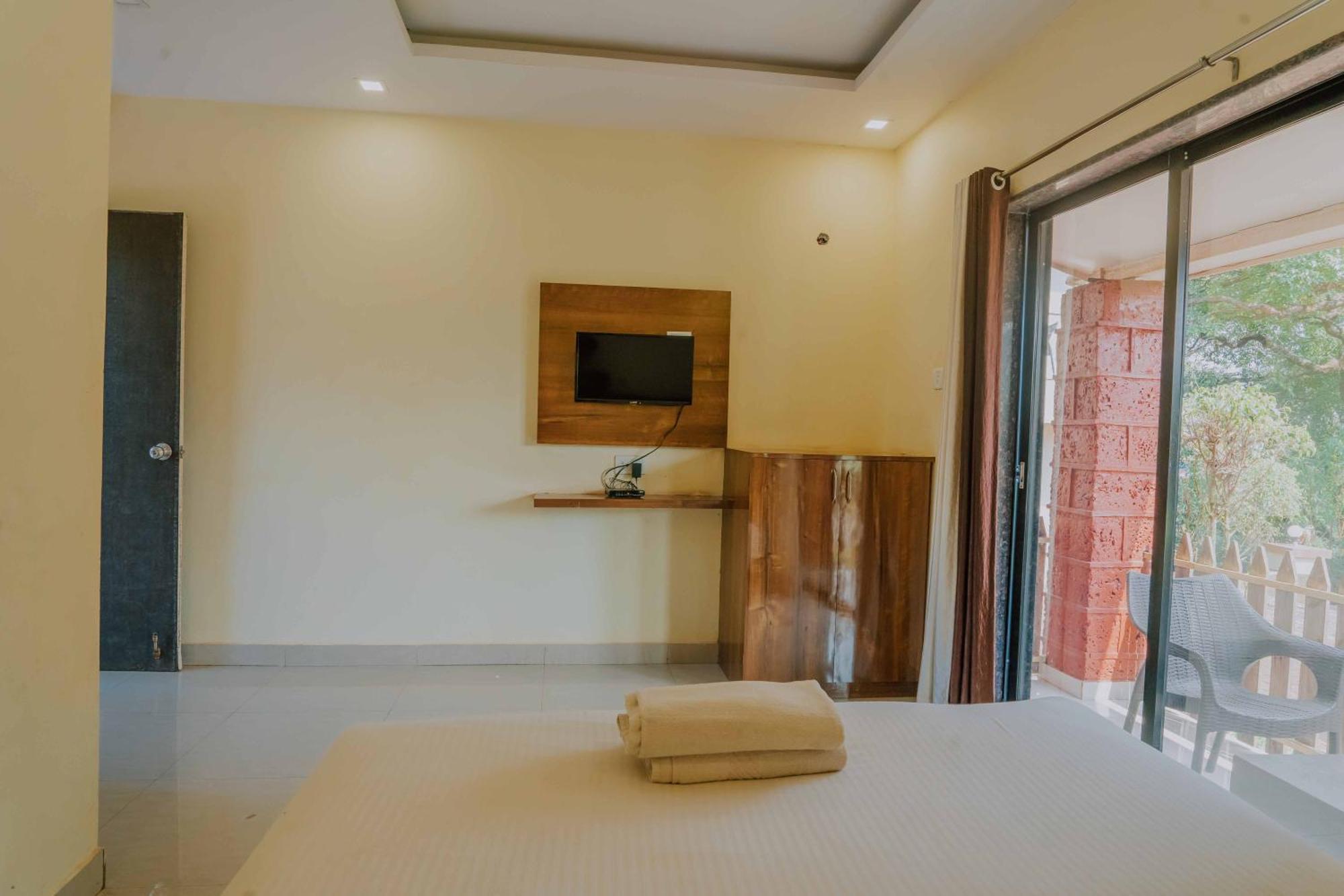 Hotel Oakwood Махабалешвар Номер фото